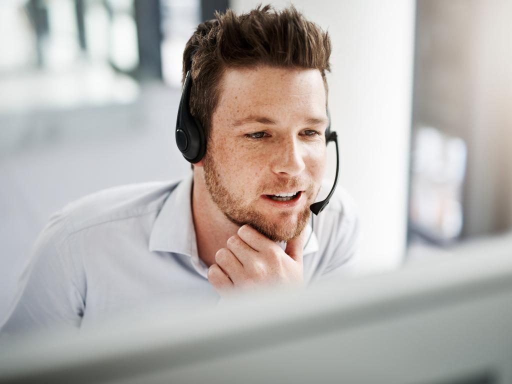 Person with headset at computer L