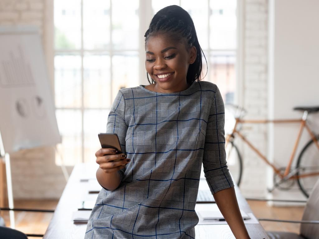 Person with phone smiling L